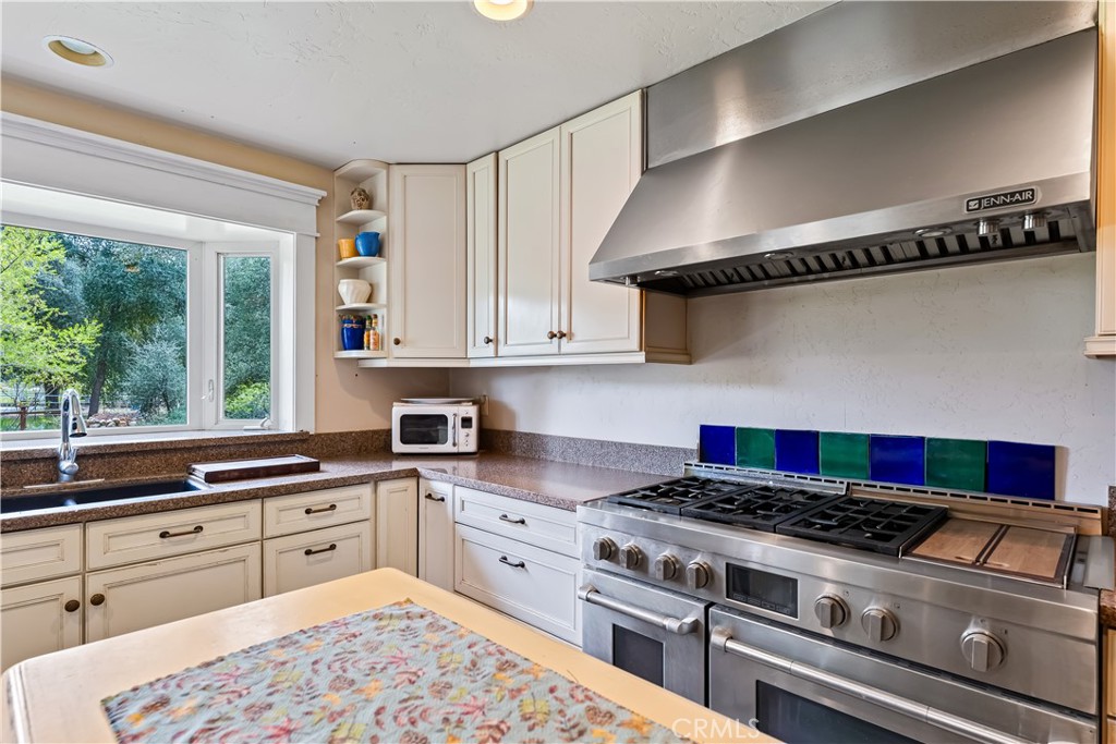 29972 Chihuahua Valley Road Warner Springs, CA 92086 - Photo 9 of 55 a kitchen with stainless steel appliances granite countertop a stove and a sink