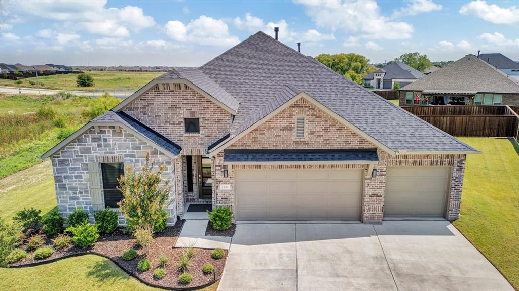 1401 Thunderbird Drive Haslet, TX 76052 - Photo 1 of 1 a view of a house with tub and potted plants