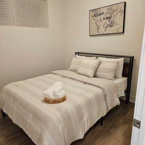 a large white bed in a small room
