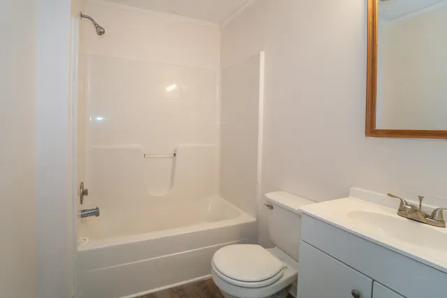 a bathroom with a toilet a sink and bathtub