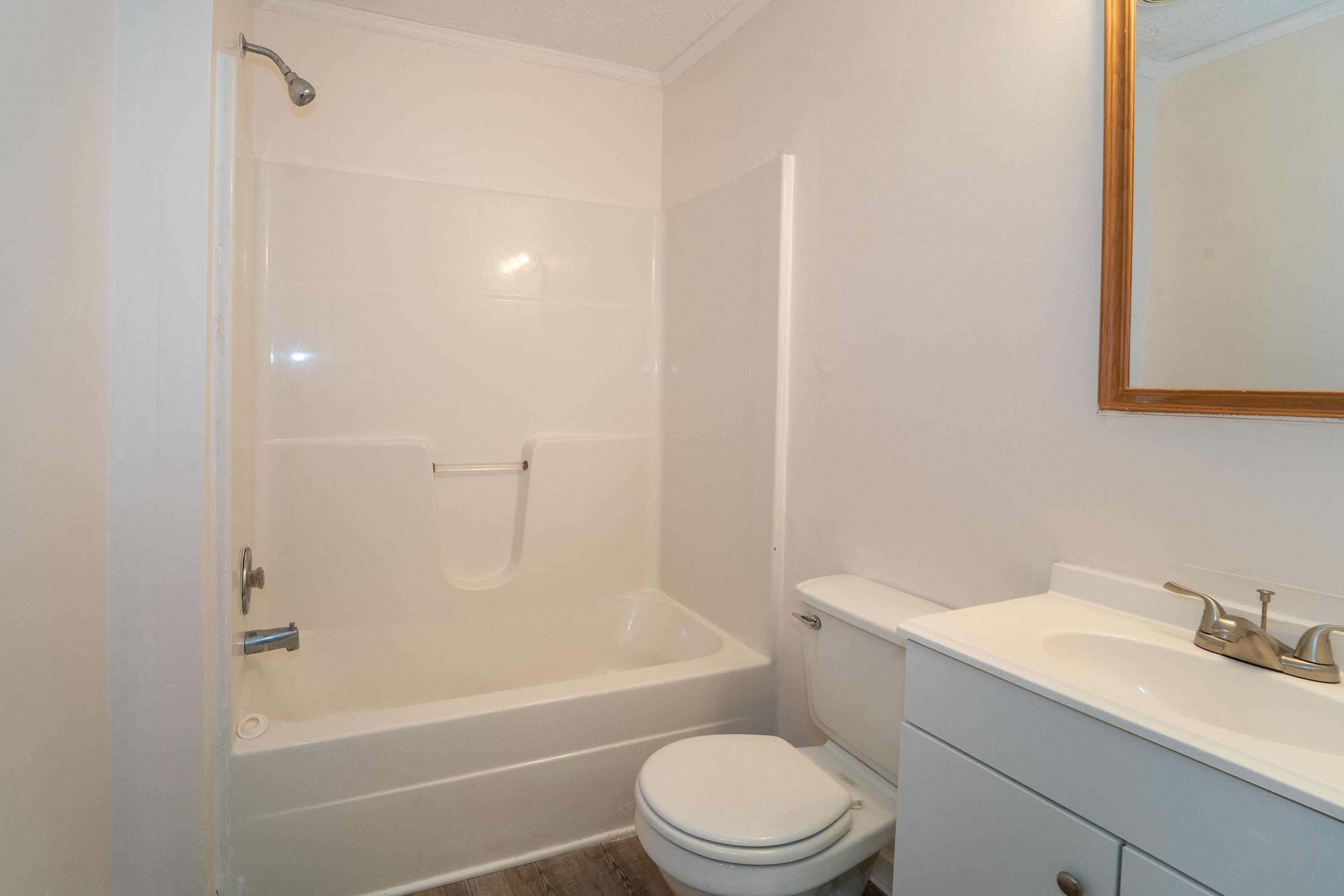 37 Evergreen Avenue, Unit A St. Augustine, FL 32084 - Photo 6 of 19 a bathroom with a toilet a sink and bathtub