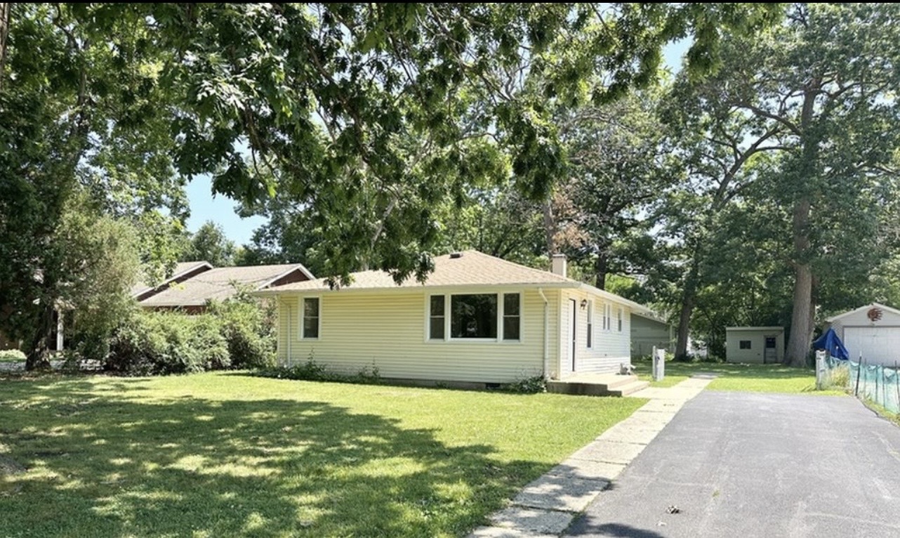 35339 North Hickory Lane Round Lake, IL 60073 - Photo 1 of 16 a front view of a house with a yard