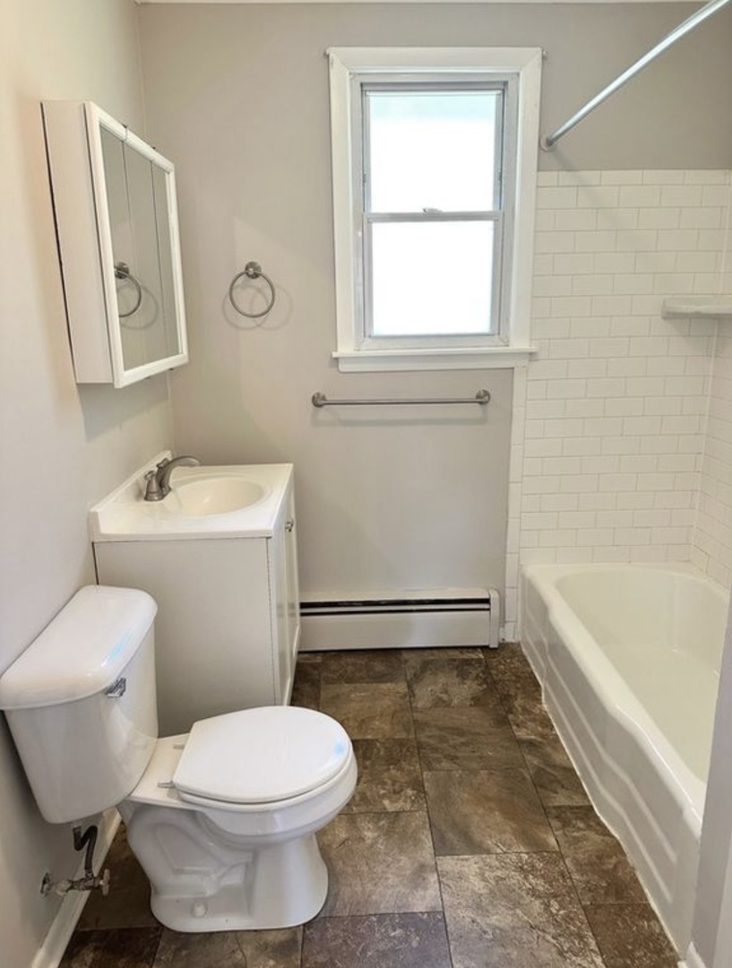 35339 North Hickory Lane Round Lake, IL 60073 - Photo 12 of 16 a bathroom with a toilet a sink and bathtub