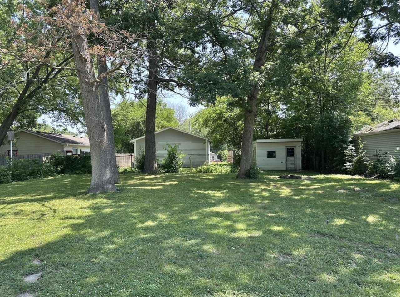 35339 North Hickory Lane Round Lake, IL 60073 - Photo 16 of 16 a house with a big yard and large trees
