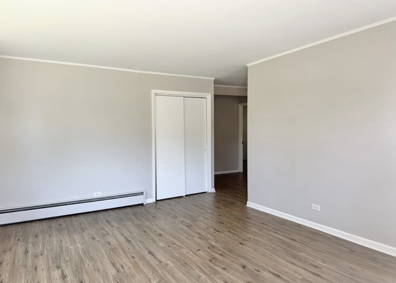 35339 North Hickory Lane Round Lake, IL 60073 - Photo 4 of 16 a view of an empty room with wooden floor