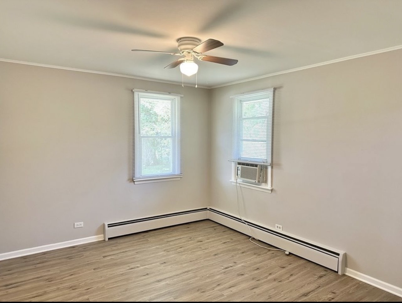 35339 North Hickory Lane Round Lake, IL 60073 - Photo 9 of 16 a view of an empty room with wooden floor and a window