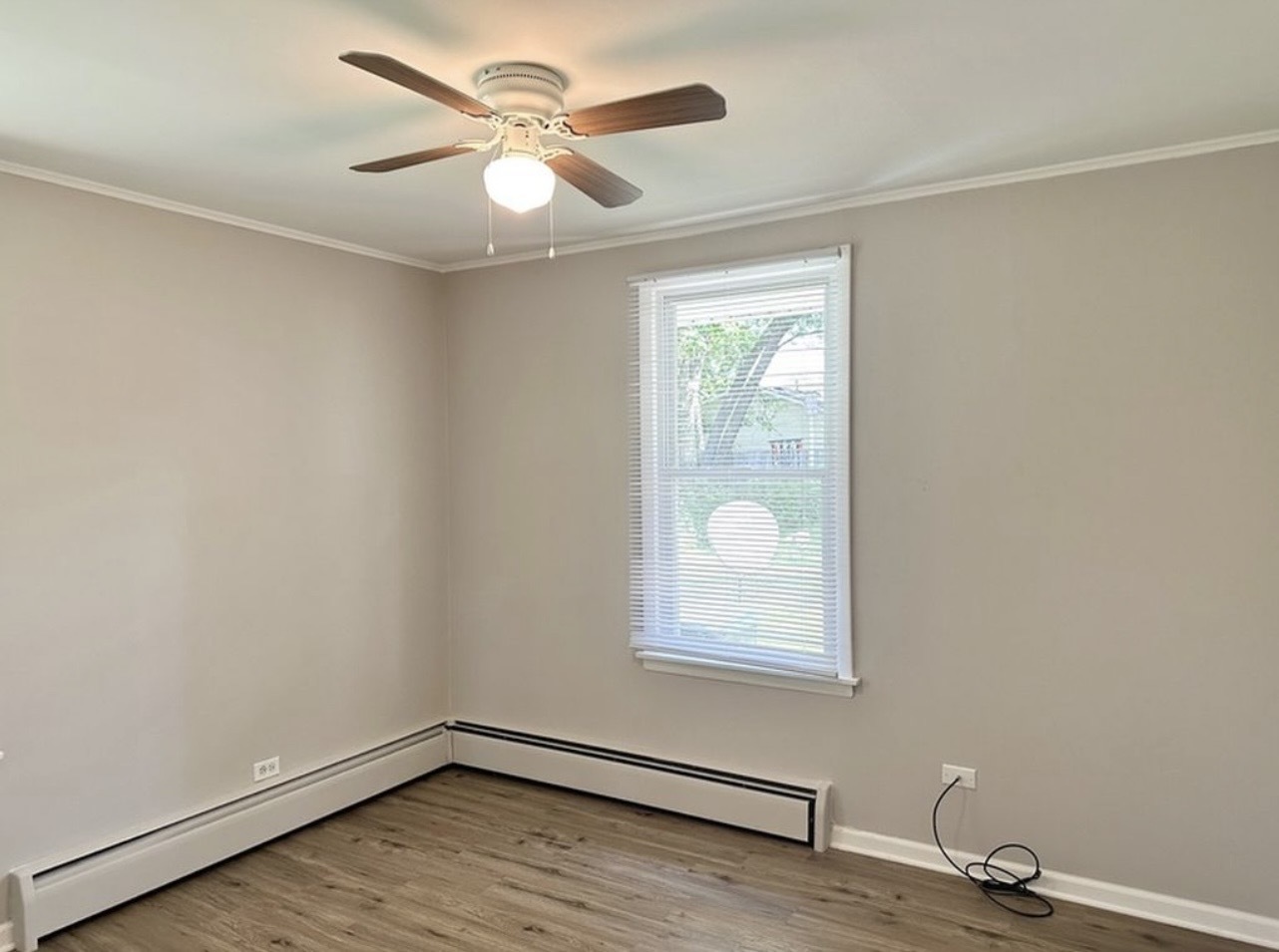 35339 North Hickory Lane Round Lake, IL 60073 - Photo 10 of 16 an empty room with windows and fan