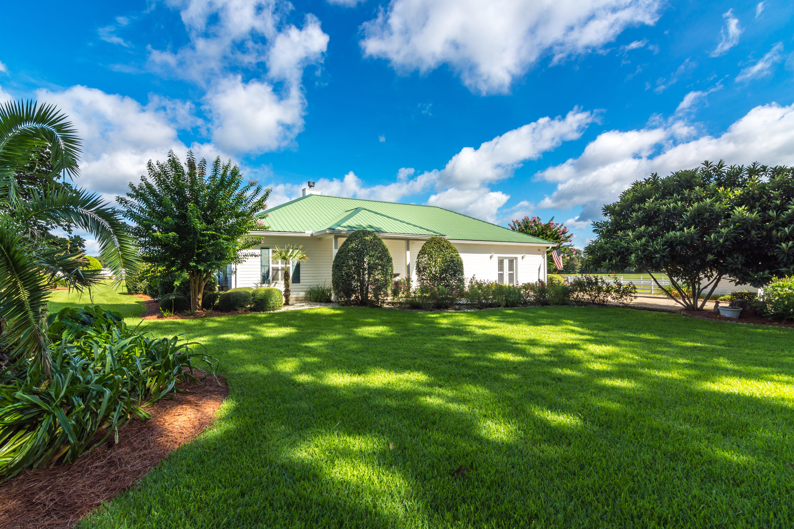 5676 Highway 2 DeFuniak Springs, FL 32433 - Photo 32 of 66 a front view of a house with a yard