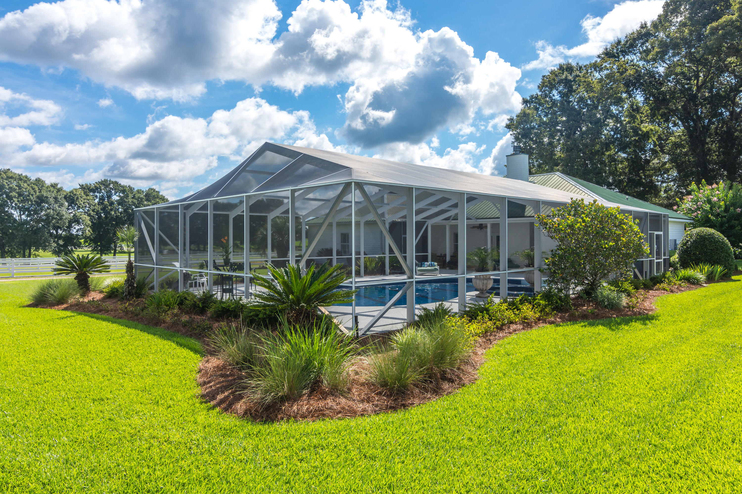 5676 Highway 2 DeFuniak Springs, FL 32433 - Photo 33 of 66 a view of a house with a backyard and a patio