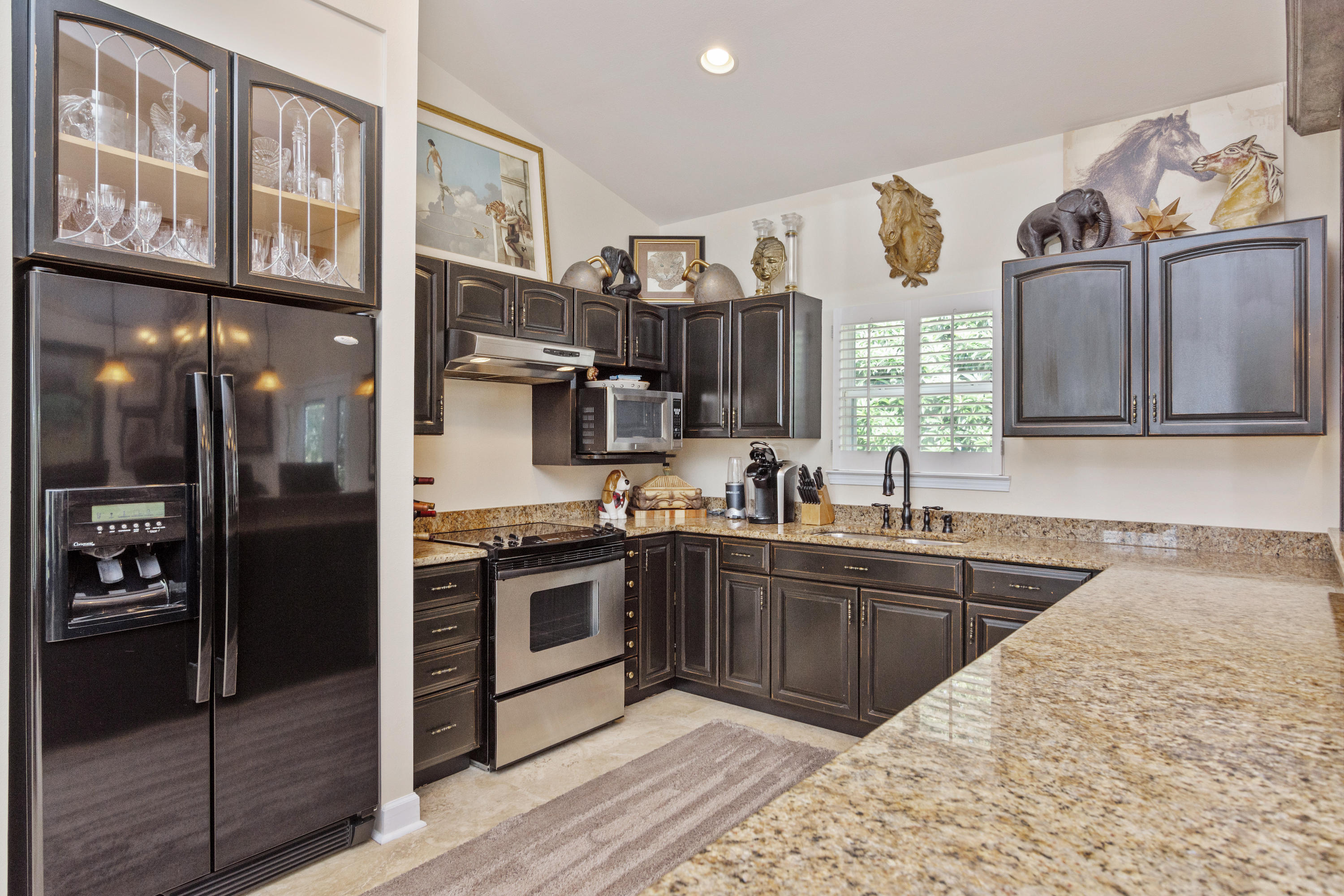 5676 Highway 2 DeFuniak Springs, FL 32433 - Photo 39 of 66 a kitchen with stainless steel appliances granite countertop a refrigerator and a sink