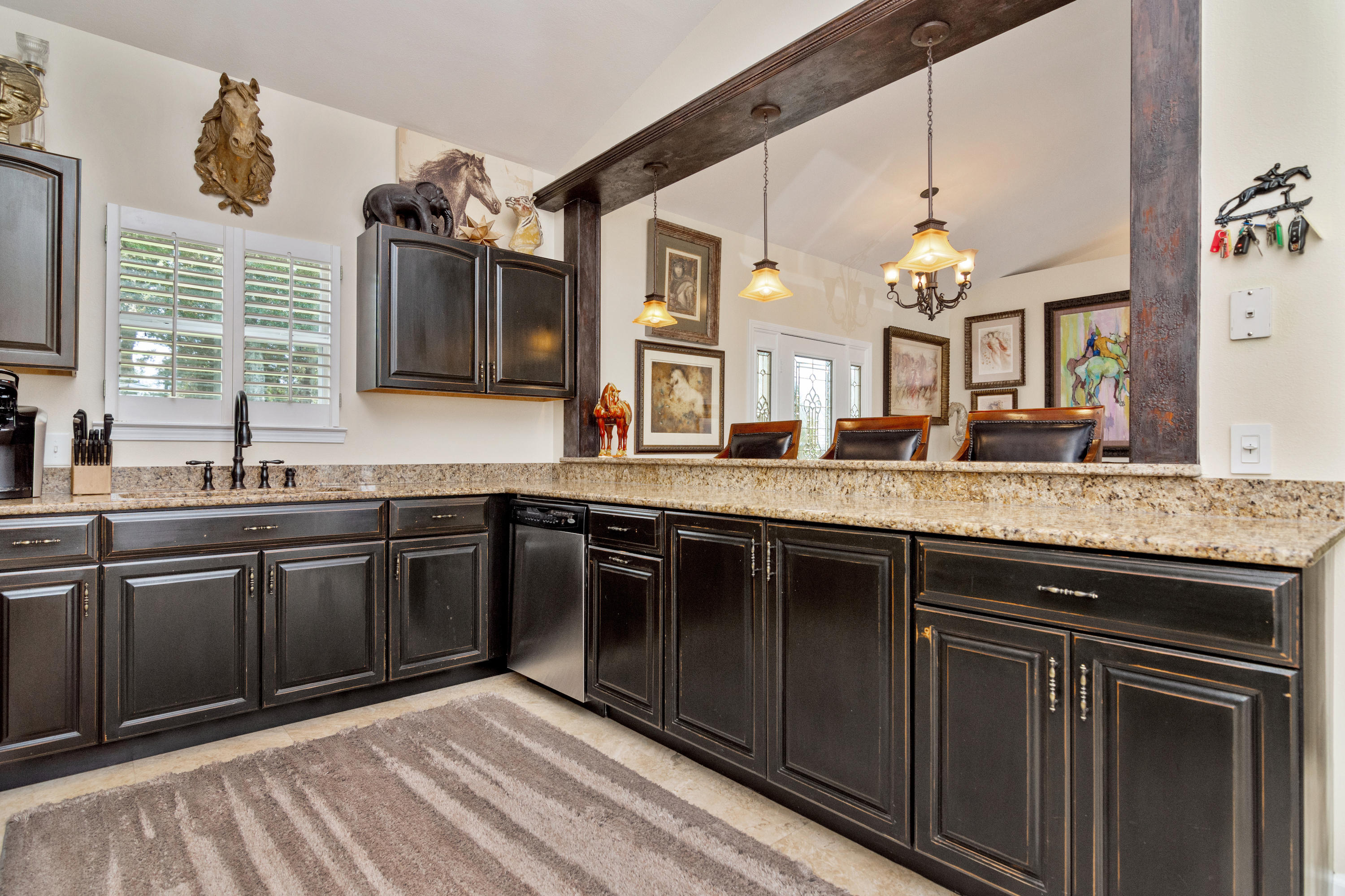 5676 Highway 2 DeFuniak Springs, FL 32433 - Photo 40 of 66 a kitchen with granite countertop a sink cabinets and stainless steel appliances