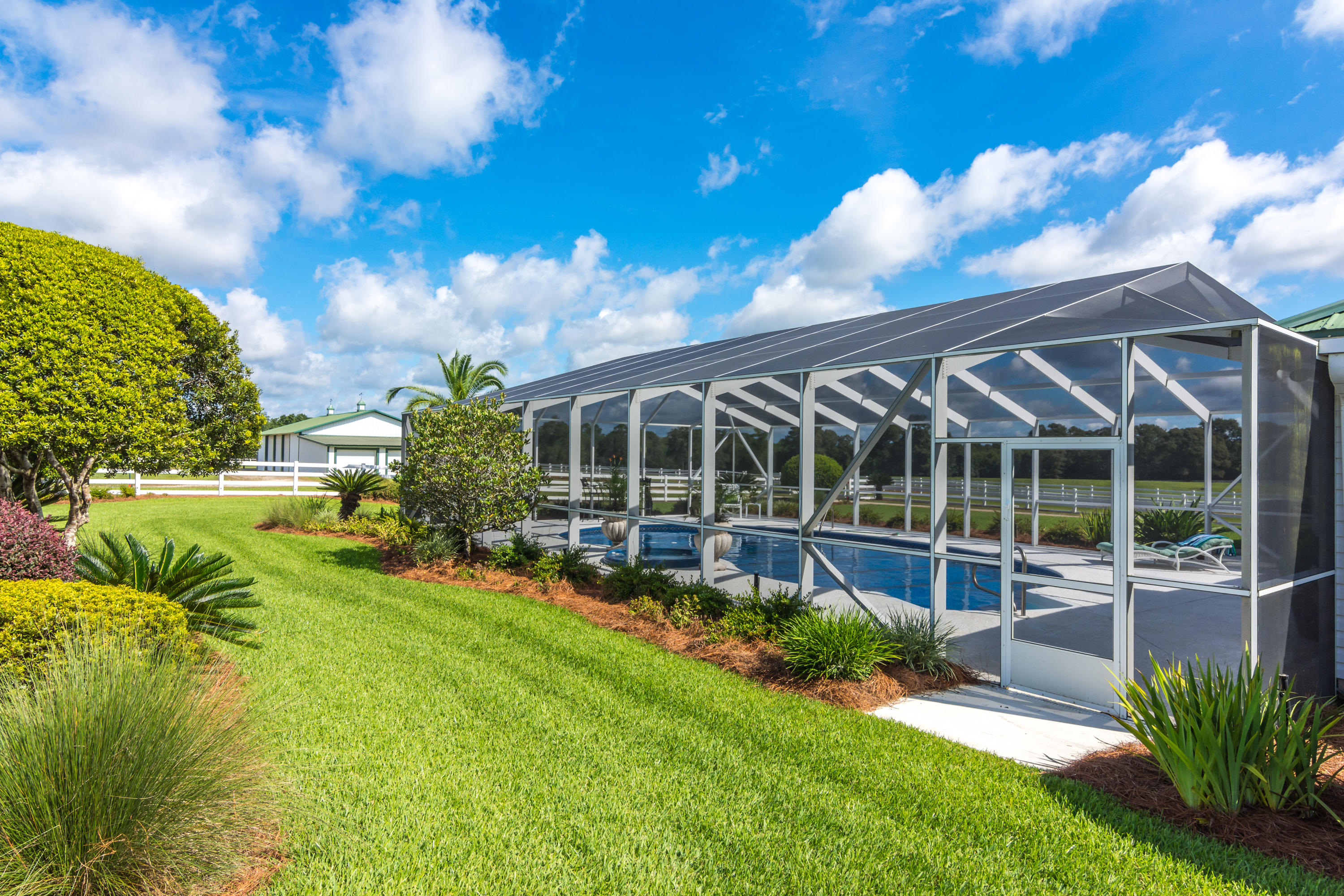 5676 Highway 2 DeFuniak Springs, FL 32433 - Photo 56 of 66 a view of a house with a yard and sitting area