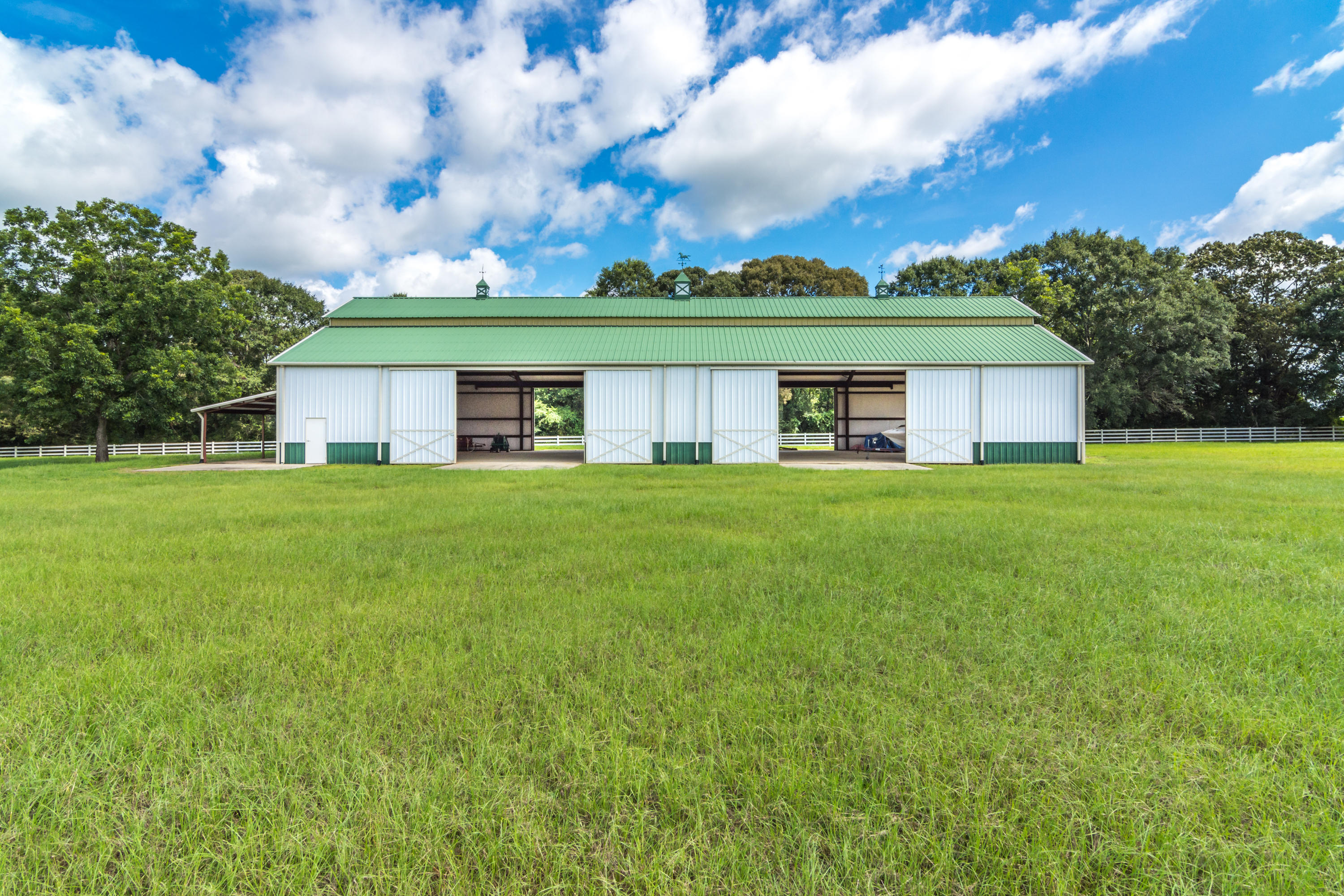 5676 Highway 2 DeFuniak Springs, FL 32433 - Photo 57 of 66 a view of a house with a big yard and large trees