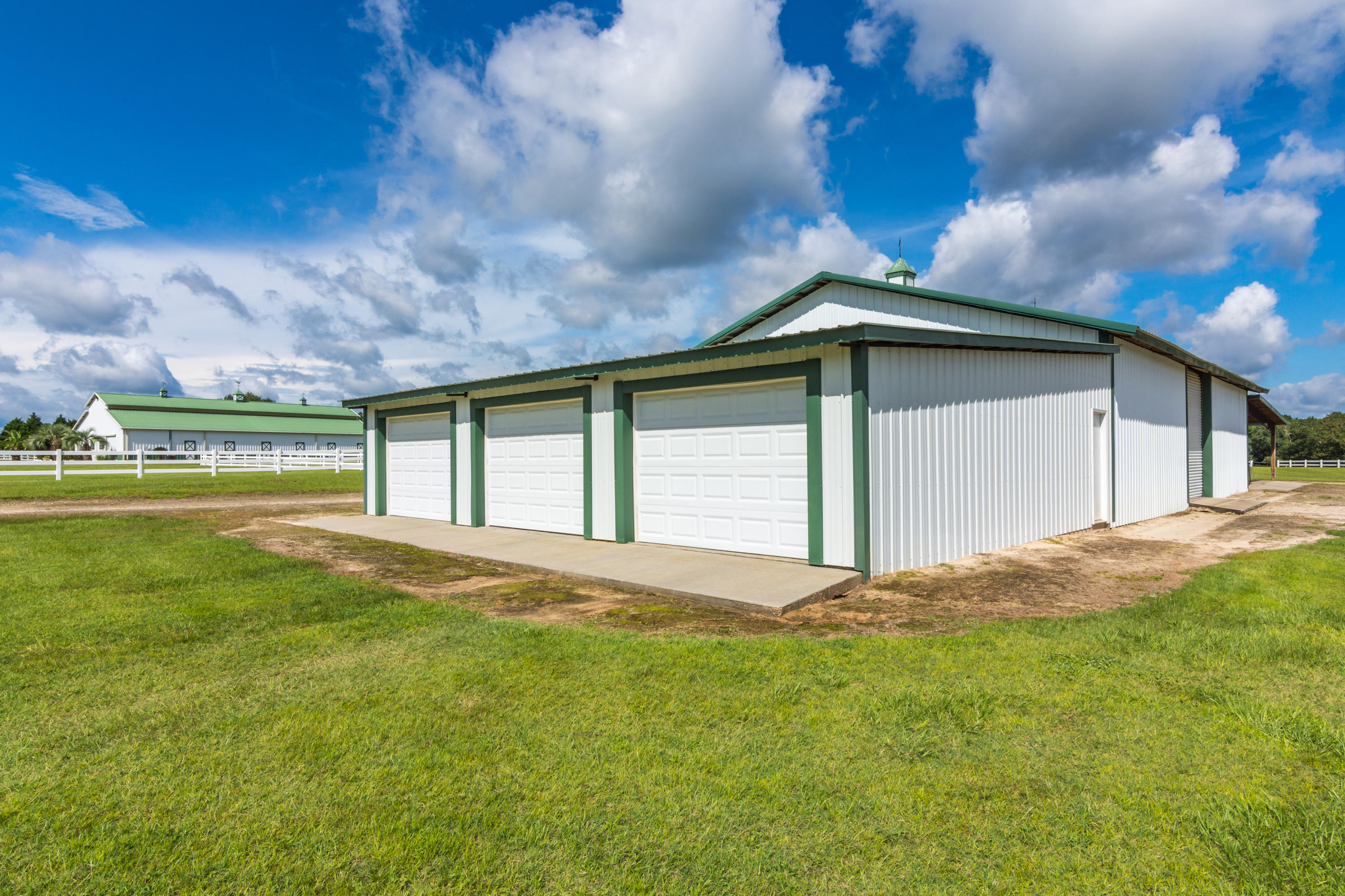 5676 Highway 2 DeFuniak Springs, FL 32433 - Photo 61 of 66 a view of a house with a yard and garage