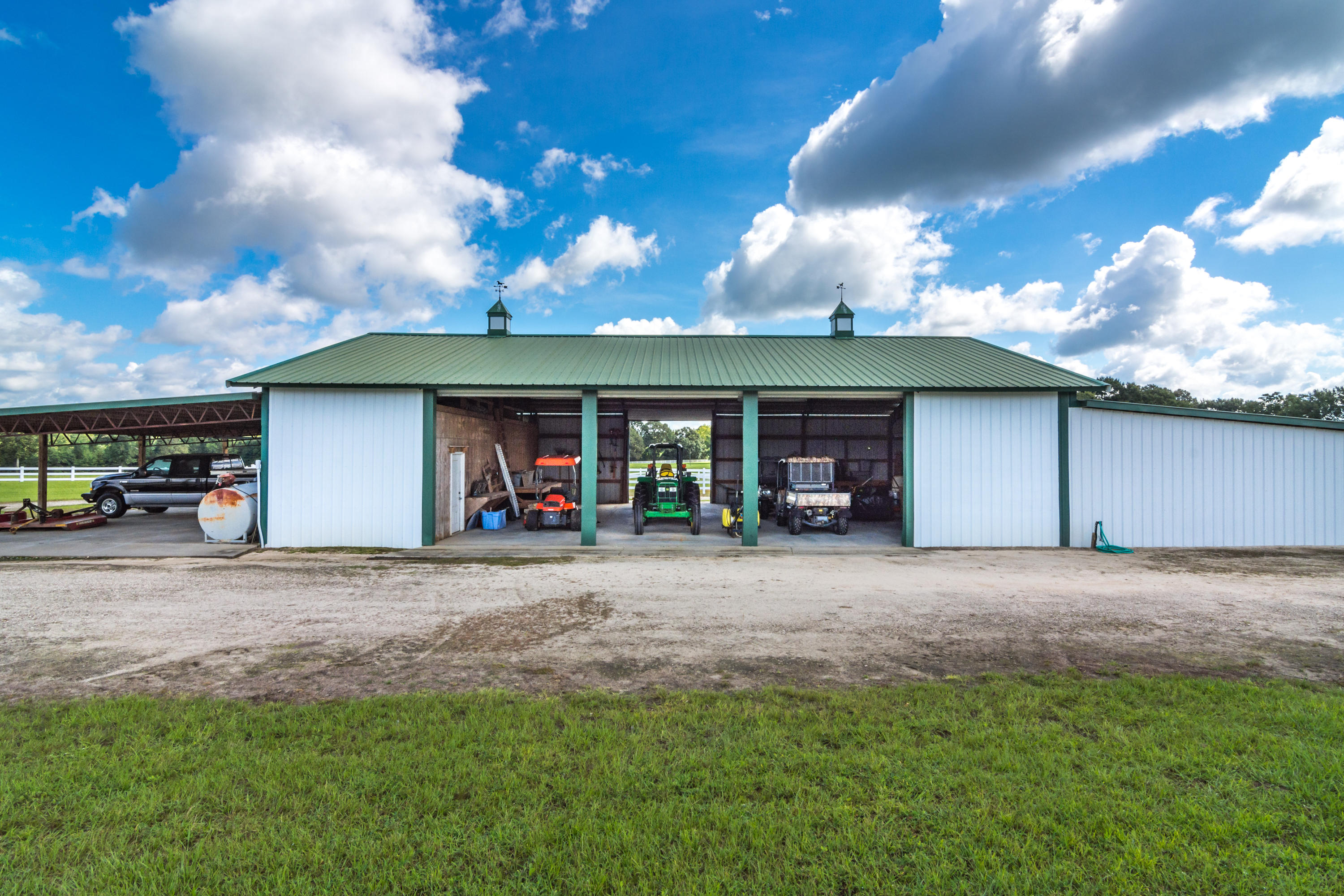 5676 Highway 2 DeFuniak Springs, FL 32433 - Photo 65 of 66 a view of a house with a yard and garage