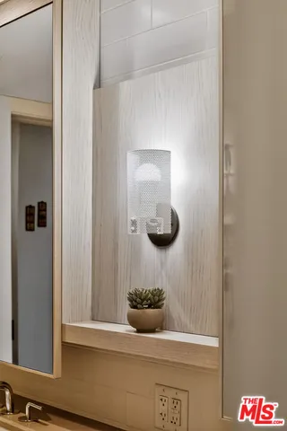 a bathroom with a tub shower sink and mirror