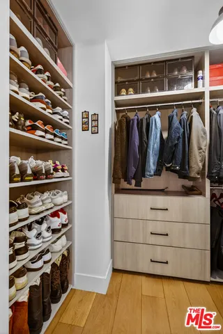 a view of a hallway with furniture