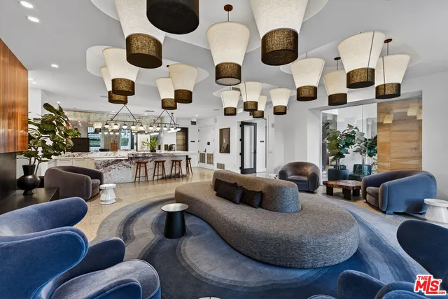 a living room with furniture and flat screen tv