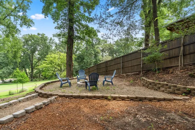 a backyard of a house with trampoline