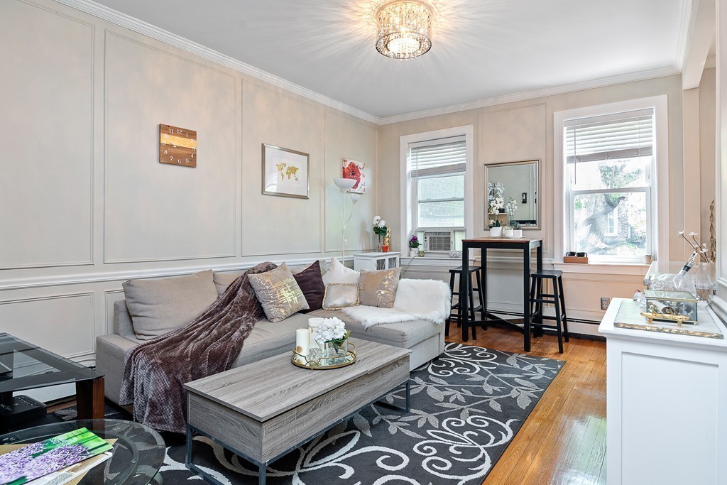 8 Lindall Place, Unit 2 Boston, MA 02114 - Photo 2 of 21 a living room with furniture and a table