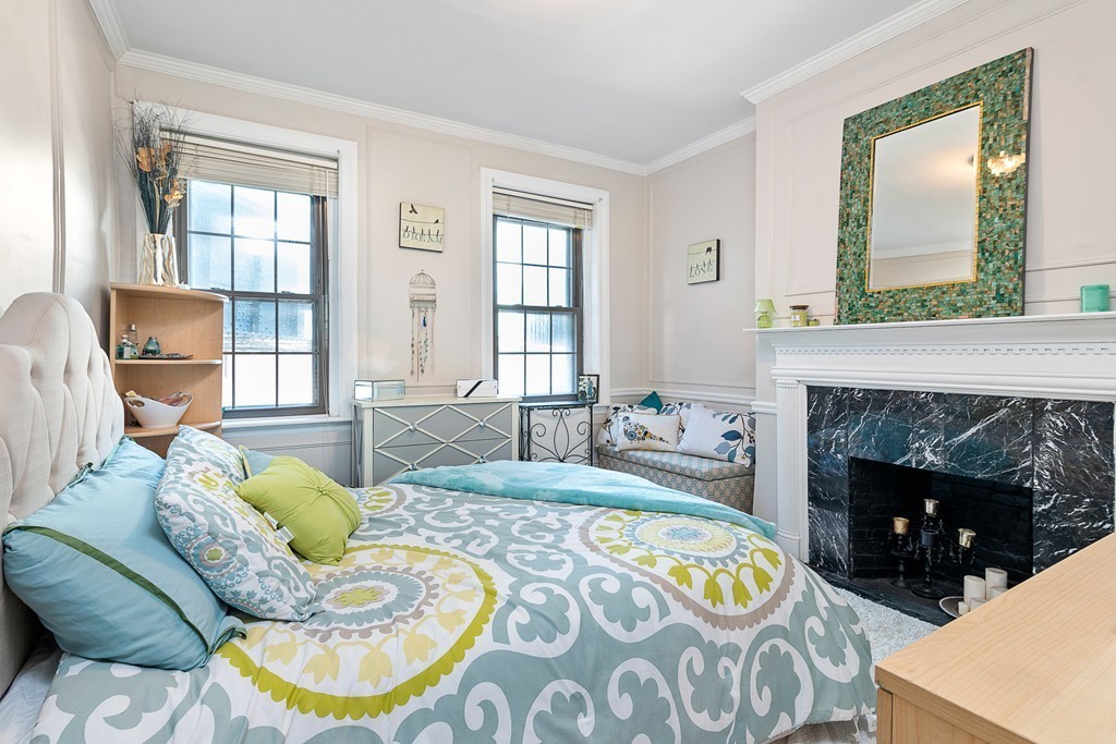 8 Lindall Place, Unit 2 Boston, MA 02114 - Photo 7 of 21 a living room with a couch and a fireplace