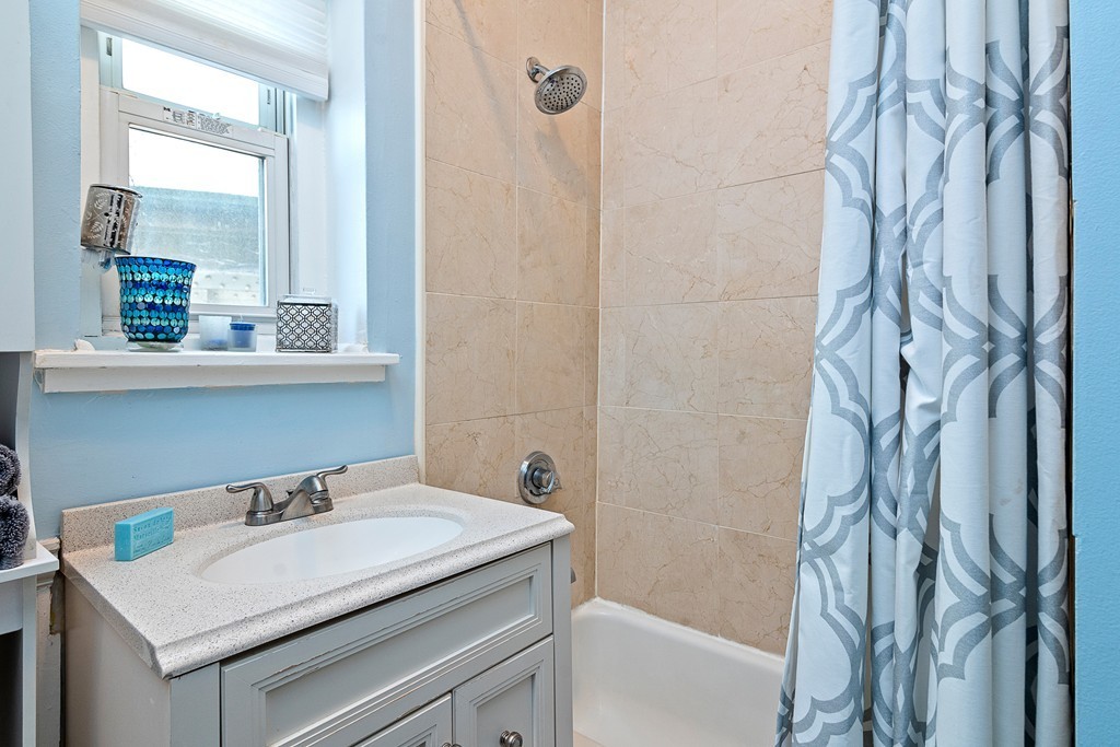 8 Lindall Place, Unit 2 Boston, MA 02114 - Photo 9 of 21 a bathroom with a sink and a mirror