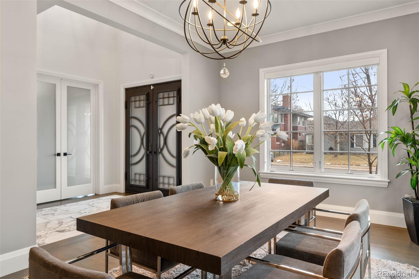 1645 South Cook Street Denver, CO 80210 - Photo 21 of 48 a view of a dining room with furniture window and wooden floor