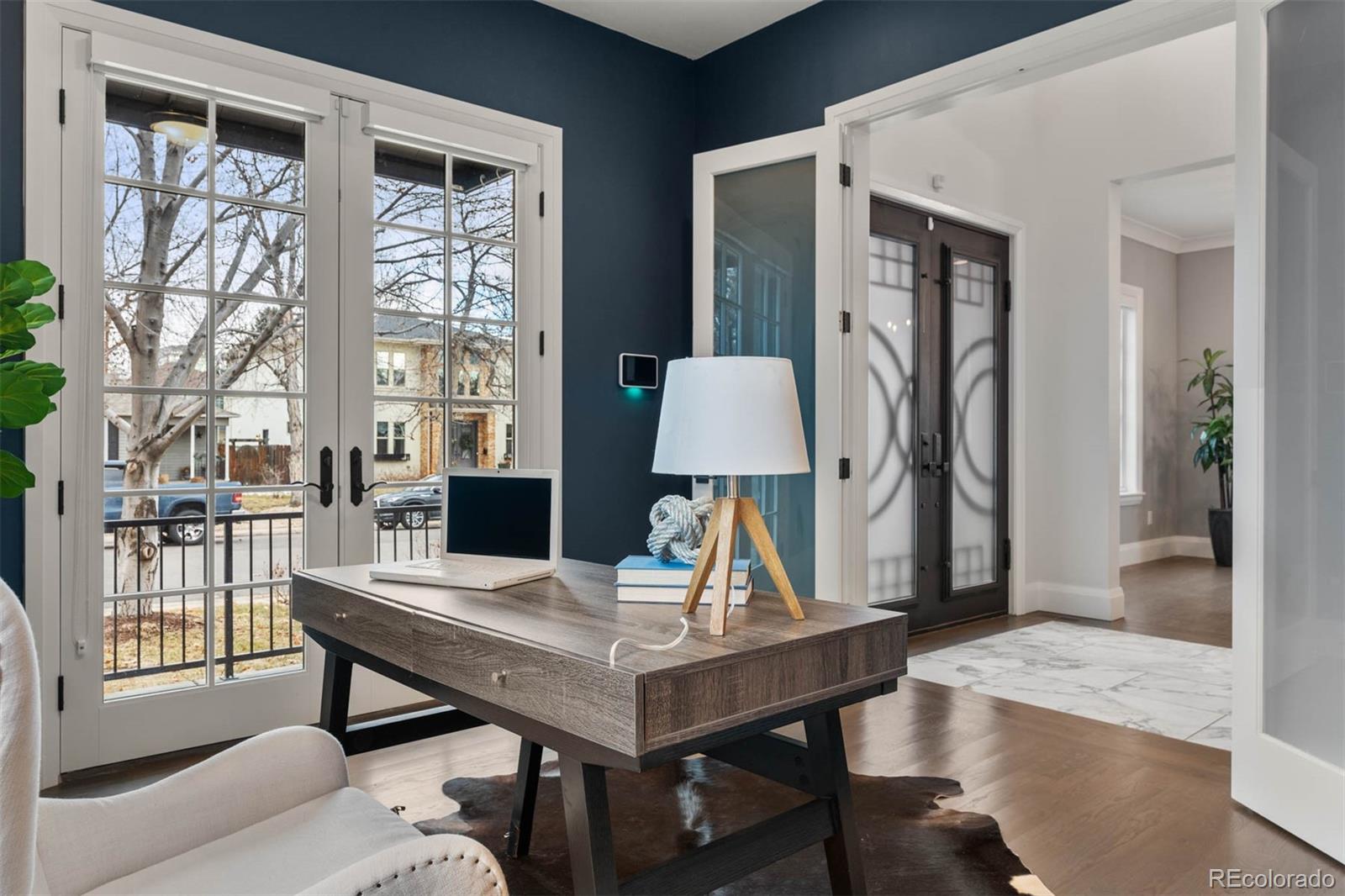 1645 South Cook Street Denver, CO 80210 - Photo 23 of 48 a view of a livingroom with furniture and window