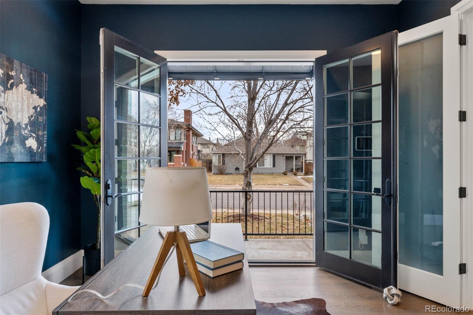 1645 South Cook Street Denver, CO 80210 - Photo 24 of 48 a view of a chair and table in the balcony