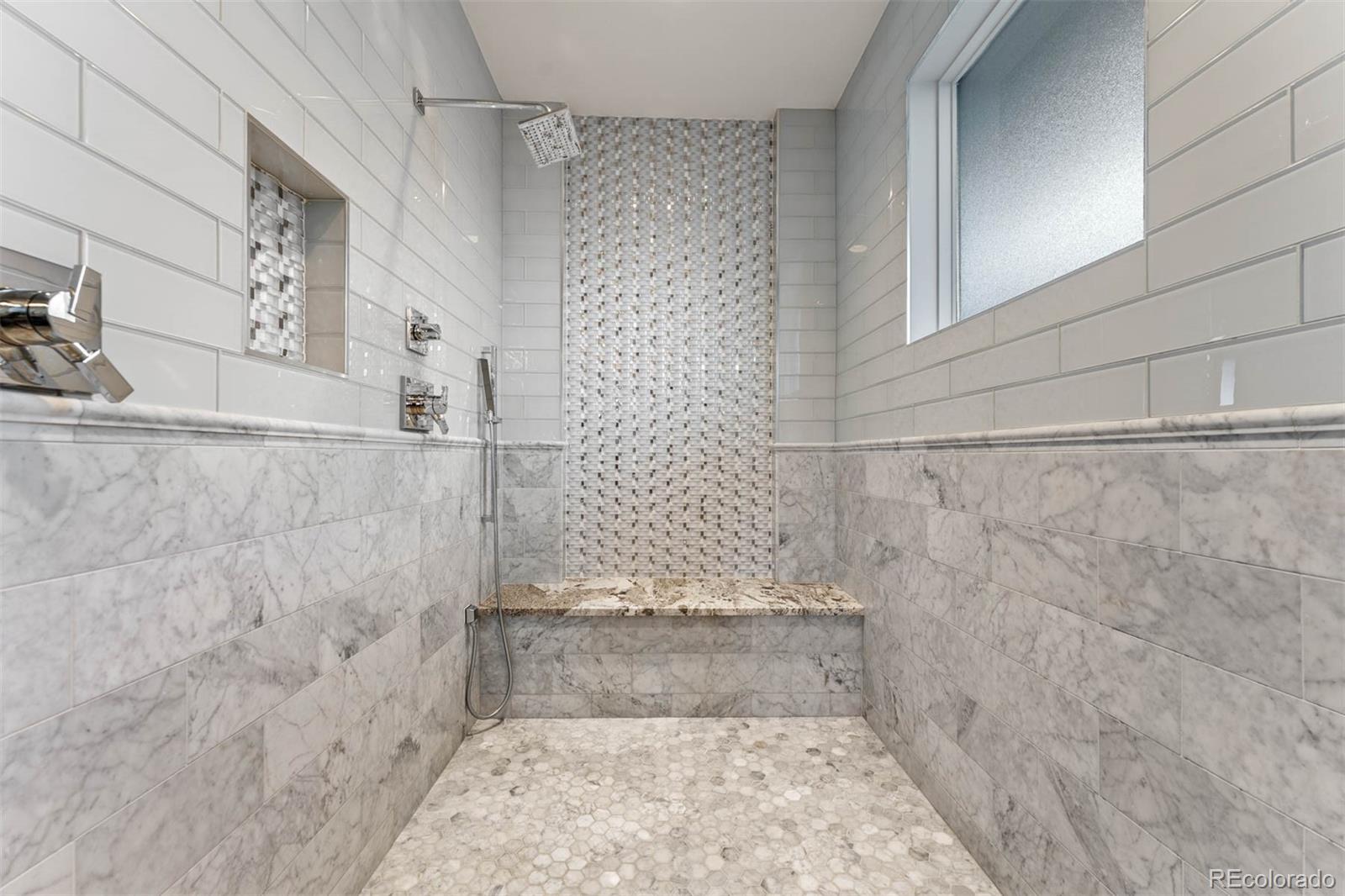 1645 South Cook Street Denver, CO 80210 - Photo 33 of 48 a bathroom with a shower