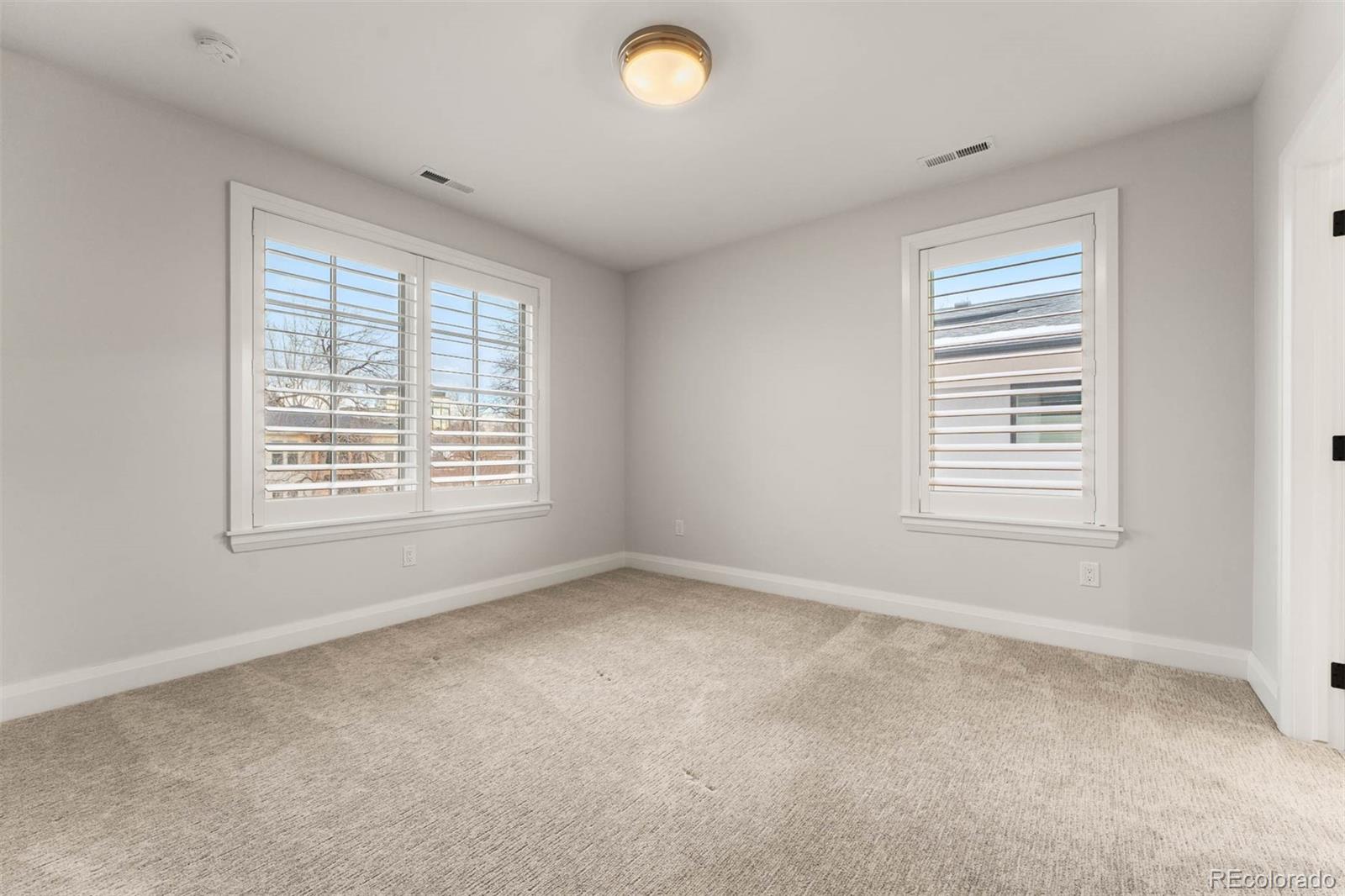 1645 South Cook Street Denver, CO 80210 - Photo 34 of 48 a view of an empty room with a window