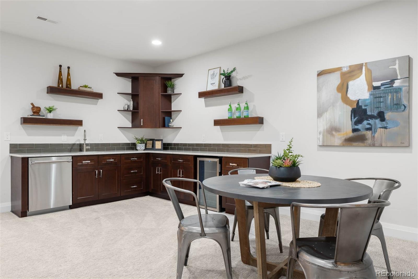 1645 South Cook Street Denver, CO 80210 - Photo 40 of 48 a kitchen with a table chairs stove and cabinets