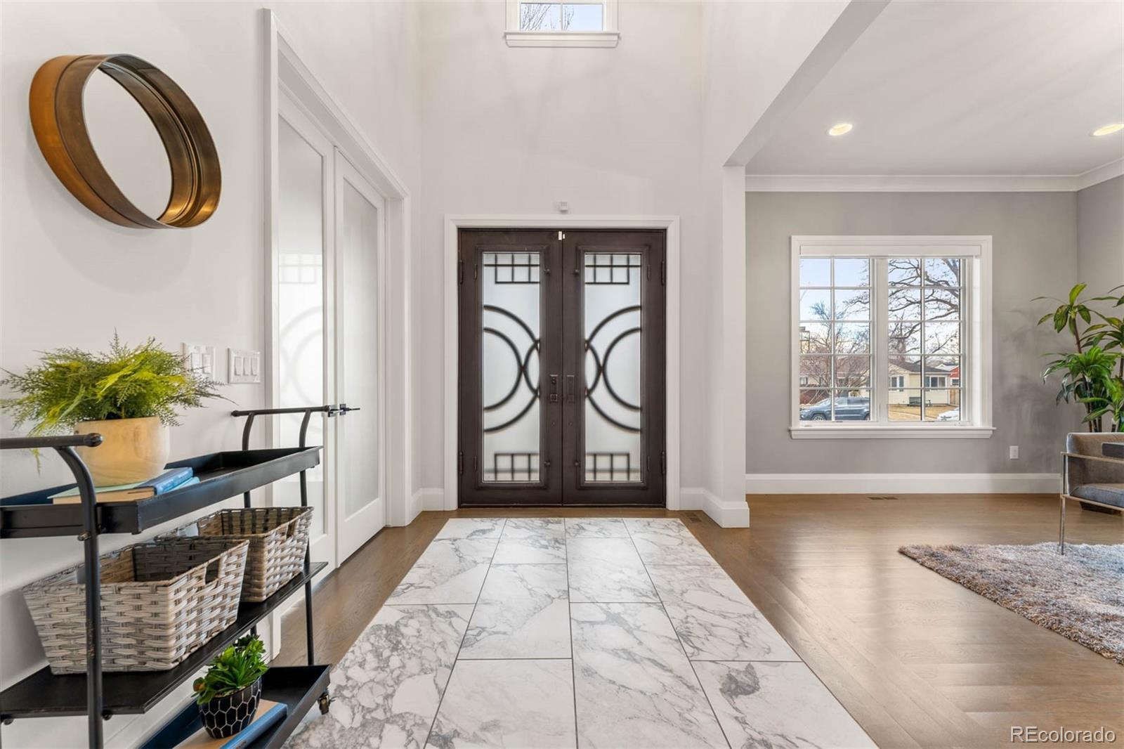 1645 South Cook Street Denver, CO 80210 - Photo 4 of 48 a view of entryway with livingroom and stairs