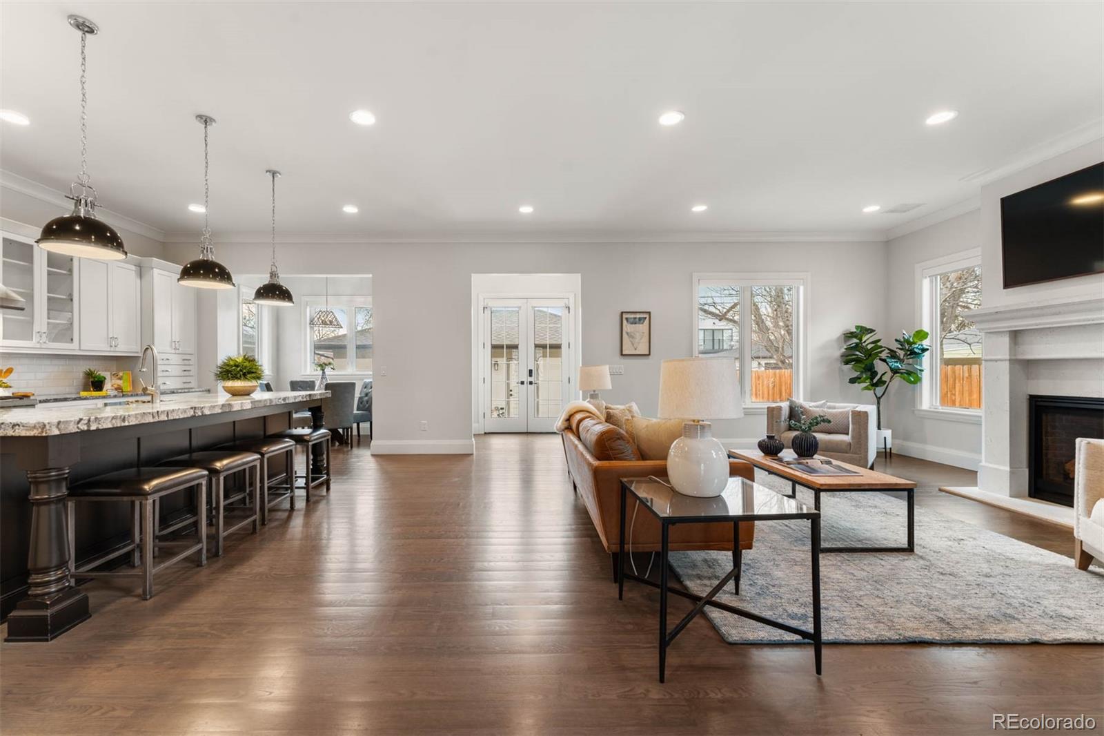 1645 South Cook Street Denver, CO 80210 - Photo 5 of 48 a living room with fireplace furniture and a flat screen tv