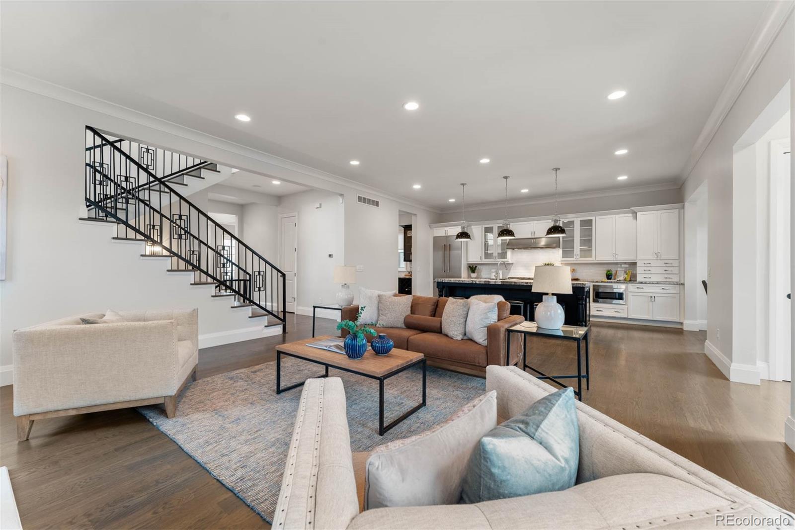 1645 South Cook Street Denver, CO 80210 - Photo 8 of 48 a living room with furniture and wooden floor