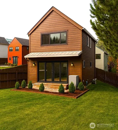 aerial view of a house with a yard