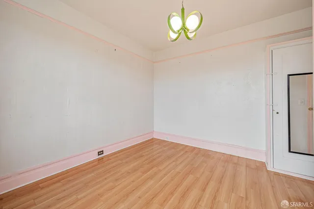 a view of room with wooden floor