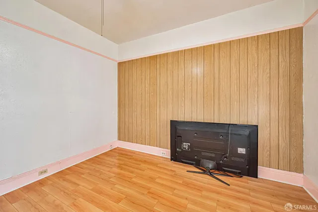 a view of room with window and dresser