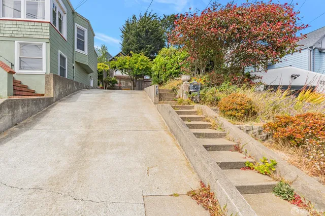 a view of a pathway with a yard