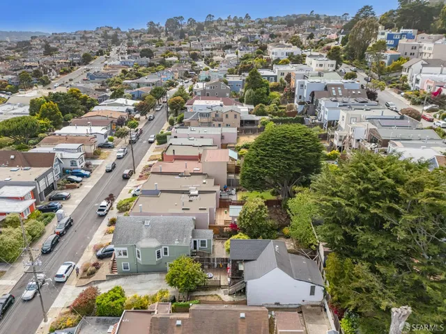 an aerial view of a city with lots of residential buildings