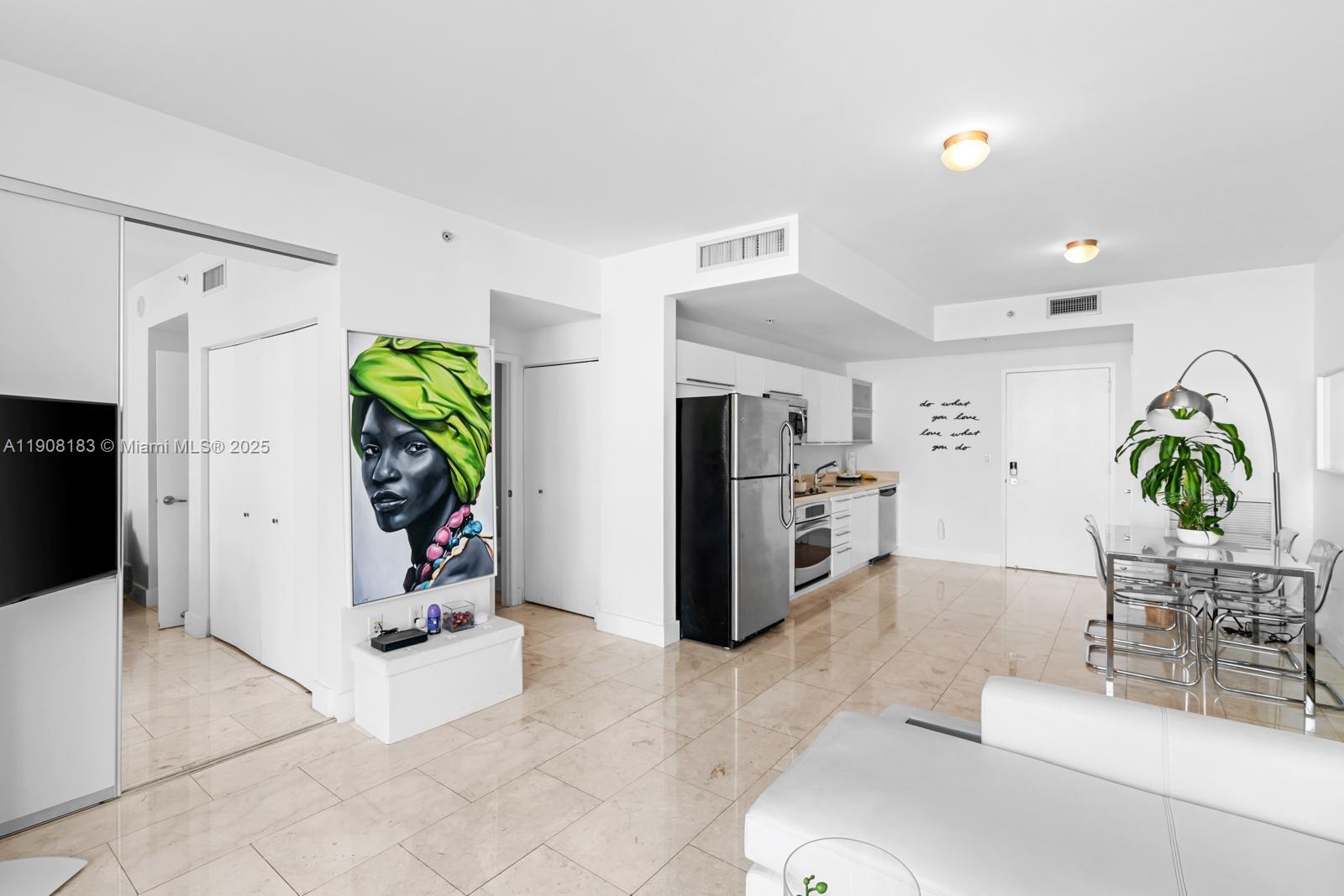 90 Southwest 3rd Street, Unit 1209 Miami, FL 33130 - Photo 19 of 19 a living room with furniture and a potted plant