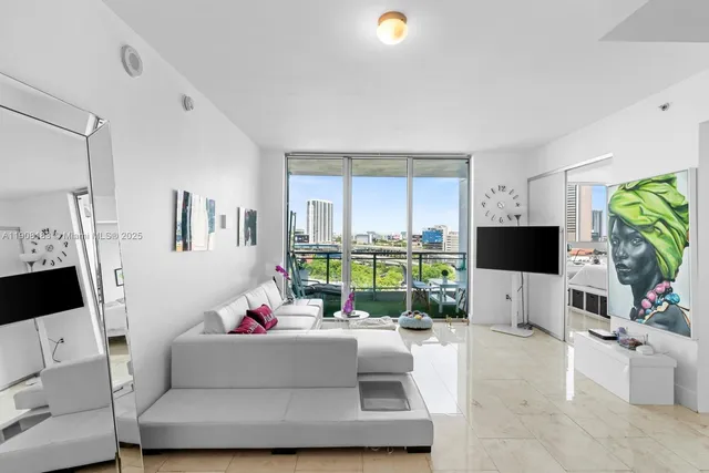 a living room with furniture and a flat screen tv
