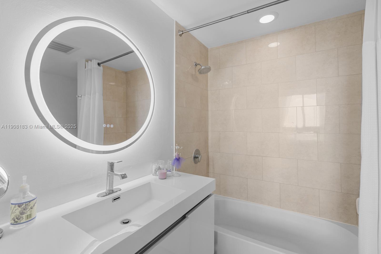 90 Southwest 3rd Street, Unit 1209 Miami, FL 33130 - Photo 10 of 19 a bathroom with a sink a toilet and a mirror