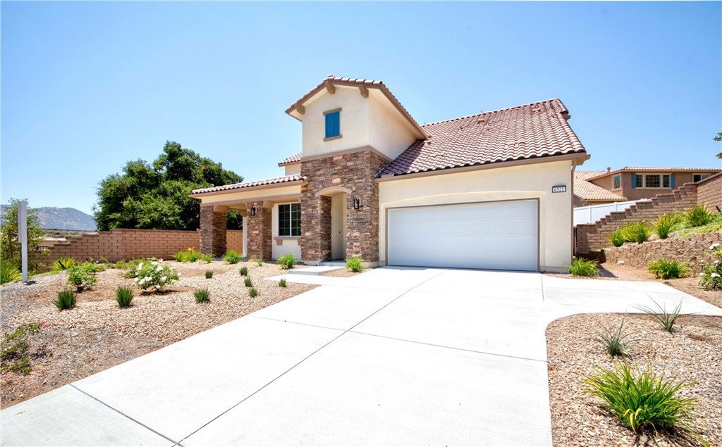 6521 Canyon Oaks Drive Simi Valley, CA 93063 - Photo 2 of 39 a front view of a house with patio