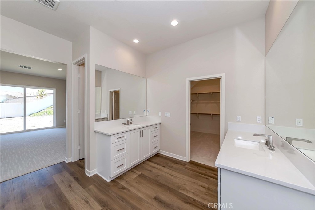 6521 Canyon Oaks Drive Simi Valley, CA 93063 - Photo 22 of 39 a room with a sink and a large mirror