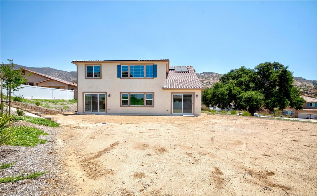 6521 Canyon Oaks Drive Simi Valley, CA 93063 - Photo 30 of 39 a front view of a house with a yard