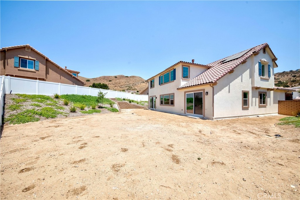 6521 Canyon Oaks Drive Simi Valley, CA 93063 - Photo 31 of 39 a front view of a house with a yard