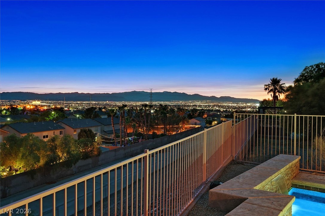 2447 Kaymin Ridge Road Henderson, NV 89052 - Photo 40 of 40 Panoramic mountain and sparkling city light views frame this elevated outdoor vantage point.
