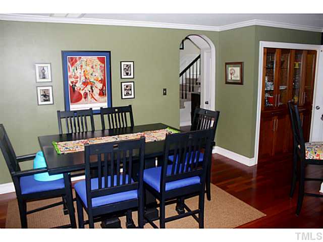5009 Raintree Court Raleigh, NC 27609 - Photo 6 of 23 a view of a dining room with furniture and wooden floor