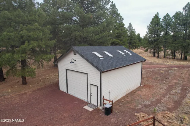 a view of two chairs in the balcony
